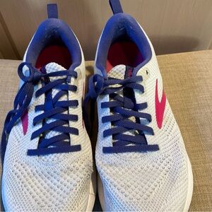 White and Blue Athletic Shoes with Pink Accents